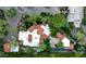 Stunning aerial view of the property showcasing a luxurious pool, a well-designed patio, and lush landscaping at 6019 N 62Nd Pl, Paradise Valley, AZ 85253