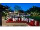 This landscaped backyard showcases a lush lawn, comfortable seating, and mature trees at 6019 N 62Nd Pl, Paradise Valley, AZ 85253