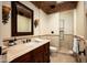 Bathroom with a detailed vanity, stone countertop, and glass-enclosed shower showcasing luxurious design at 6019 N 62Nd Pl, Paradise Valley, AZ 85253