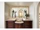 Elegant bathroom vanity featuring a decorative sink and large mirror, offering a luxurious feel at 6019 N 62Nd Pl, Paradise Valley, AZ 85253