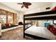 Charming bedroom with built-in window seating, fireplace, and a bunk bed, perfect for relaxation and rest at 6019 N 62Nd Pl, Paradise Valley, AZ 85253