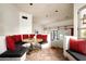 Charming breakfast nook featuring custom seating, red pillows, arched openings, and Saltillo tile flooring at 6019 N 62Nd Pl, Paradise Valley, AZ 85253