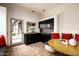 Cozy kitchen nook featuring dark cabinetry, a built-in bench, and a view of the outdoor patio at 6019 N 62Nd Pl, Paradise Valley, AZ 85253