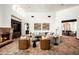 Bright living room with an arched doorway, comfortable seating, and brick floors for a warm, inviting space at 6019 N 62Nd Pl, Paradise Valley, AZ 85253