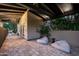 Charming covered patio with brick flooring, comfortable seating, and a relaxing ambiance at 6019 N 62Nd Pl, Paradise Valley, AZ 85253