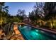 Inviting pool with lush landscaping, creating a serene outdoor oasis at 6019 N 62Nd Pl, Paradise Valley, AZ 85253