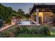 Sparkling pool with tiled fountains and lush landscaping, offering a serene outdoor retreat at 6019 N 62Nd Pl, Paradise Valley, AZ 85253