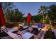 Serene poolside setting with elegant chaise lounges, providing a perfect spot for relaxation and enjoying the outdoors at 6019 N 62Nd Pl, Paradise Valley, AZ 85253