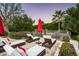 Inviting poolside lounge area with stylish chaise lounges and mature landscaping for ultimate relaxation at 6019 N 62Nd Pl, Paradise Valley, AZ 85253