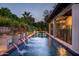 Sparkling pool with tiled fountains and lush landscaping, offering a serene outdoor retreat and patio at 6019 N 62Nd Pl, Paradise Valley, AZ 85253