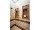 Tiled shower showcasing decorative tile accents, built in nooks, and a contemporary shower head at 6019 N 62Nd Pl, Paradise Valley, AZ 85253