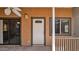 Cozy back porch with outdoor ceiling fan and an entryway door and window for added natural light at 6448 E Paso Nuevo Dr # 101, Cave Creek, AZ 85331