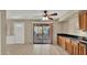 Open kitchen area with wood cabinets adjacent to an exterior sliding door at 6448 E Paso Nuevo Dr # 101, Cave Creek, AZ 85331