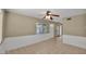 The living room offers a neutral palette, ceiling fan, and outdoor access at 6448 E Paso Nuevo Dr # 101, Cave Creek, AZ 85331