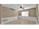 Bright living room features a ceiling fan and classic wainscoting at 6448 E Paso Nuevo Dr # 101, Cave Creek, AZ 85331