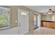 Bright room featuring tiled floors, a door with decorative glass, and a sliding door to the outside at 6448 E Paso Nuevo Dr # 101, Cave Creek, AZ 85331