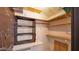 Walk-in closet with shelving, pegboard, and storage solutions at 6448 E Paso Nuevo Dr # 101, Cave Creek, AZ 85331