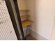 Narrow storage closet with simple shelving and pegboard at 6448 E Paso Nuevo Dr # 101, Cave Creek, AZ 85331