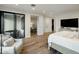 Primary bedroom featuring a sliding door to the outside and connected office and walk-in closet at 6500 E Camelback Rd # 1010, Scottsdale, AZ 85251