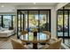Cozy dining area with a glass table, natural light, and an outdoor patio view at 6500 E Camelback Rd # 1010, Scottsdale, AZ 85251