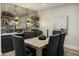 Elegant dining area with a bar, stylish seating, and modern finishes at 6500 E Camelback Rd # 1010, Scottsdale, AZ 85251