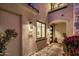 Inviting entrance with stone accents, modern lighting, and well-maintained landscaping at 6500 E Camelback Rd # 1010, Scottsdale, AZ 85251