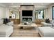 Modern living room featuring a fireplace, contemporary furniture, and ample natural light at 6500 E Camelback Rd # 1010, Scottsdale, AZ 85251