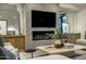 Chic living room with a sleek fireplace, contemporary design, and comfortable seating arrangements at 6500 E Camelback Rd # 1010, Scottsdale, AZ 85251