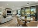 Spacious living room with floor-to-ceiling windows, stylish furniture, and modern decor at 6500 E Camelback Rd # 1010, Scottsdale, AZ 85251