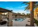 Inviting community pool with mountain views, complemented by palm trees and outdoor seating at 6500 E Camelback Rd # 1010, Scottsdale, AZ 85251