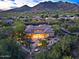 Aerial view of secluded home with pool, outdoor kitchen, fire pit, and desert landscaping at 6591 E Amber Sun Dr, Scottsdale, AZ 85266
