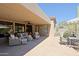 Covered back patio with comfortable seating and desert views, providing a relaxing outdoor living space at 6591 E Amber Sun Dr, Scottsdale, AZ 85266