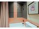 Bathroom showing tub, toilet and framed picture on the wall at 6591 E Amber Sun Dr, Scottsdale, AZ 85266