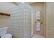 Charming bathroom featuring a walk-in glass block shower and tiled flooring at 6591 E Amber Sun Dr, Scottsdale, AZ 85266