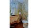 Funky bathroom features colorful wallpaper and unique sink at 6591 E Amber Sun Dr, Scottsdale, AZ 85266