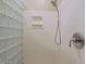 Bright shower featuring glass block wall, updated showerhead and sleek fixtures at 6591 E Amber Sun Dr, Scottsdale, AZ 85266