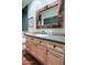 Bathroom features a spacious vanity, a decorative mirror, and well-lit space at 6591 E Amber Sun Dr, Scottsdale, AZ 85266