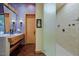 Contemporary bathroom featuring a trough sink, an open shower, and an outdoor view at 6591 E Amber Sun Dr, Scottsdale, AZ 85266