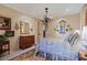 Serene bedroom with elegant decor, chandelier, and seamless transition to hallway at 6591 E Amber Sun Dr, Scottsdale, AZ 85266