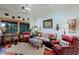 Cozy living room features comfortable seating, a decorative rug, and a large window with desert landscape views at 6591 E Amber Sun Dr, Scottsdale, AZ 85266