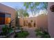 This is a beautiful rock garden with cactus and a small statue feature at 6591 E Amber Sun Dr, Scottsdale, AZ 85266