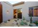 This is a beautiful rock garden featuring a window into the home at 6591 E Amber Sun Dr, Scottsdale, AZ 85266