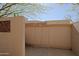 Exterior shot of secure and private outdoor storage area featuring double doors and a neutral stucco finish at 6591 E Amber Sun Dr, Scottsdale, AZ 85266
