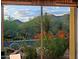 Scenic desert landscaping with distant mountains viewed through a large window at 6591 E Amber Sun Dr, Scottsdale, AZ 85266