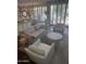 Bright living room with comfortable seating and floor-to-ceiling windows at 7222 E Gainey Ranch Rd # 106, Scottsdale, AZ 85258