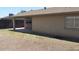 The home's backyard features an open layout and a covered patio area at 7506 W Devonshire Ave, Phoenix, AZ 85033