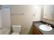 Cozy bathroom features a vanity with sink, toilet and a shower/tub combo at 7506 W Devonshire Ave, Phoenix, AZ 85033