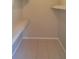 Walk-in closet featuring tile flooring and shelving at 7506 W Devonshire Ave, Phoenix, AZ 85033