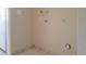 A functional laundry room features utility hookups and tiled flooring at 7506 W Devonshire Ave, Phoenix, AZ 85033