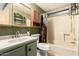 Compact bathroom with a vanity, toilet, and bathtub featuring bright lighting at 7807 E Main St # Cc105, Mesa, AZ 85207